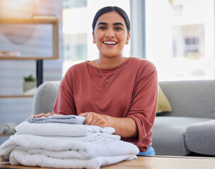 Cleaning, smile and laundry with portrait of woman in living room for housekeeping service, clothes...