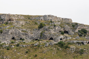 View of the city of Matera by day. Typical Salento illuminations during the holidays. Feast of the Brown Madonna, Matera. Prehistoric caves from the Murgia.Mysterious and ancient land among the stones