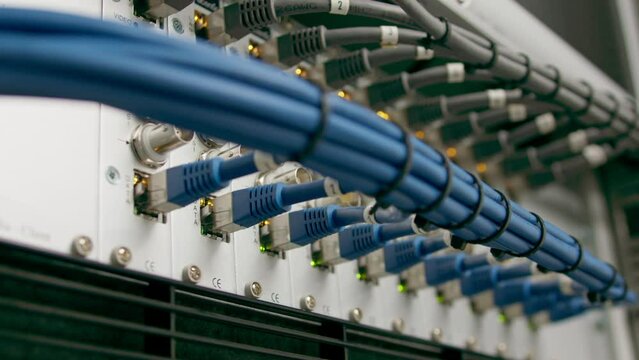 close-up of a pile of network patch cables in a server room in a data center room Data transmission by fiber optic information technology