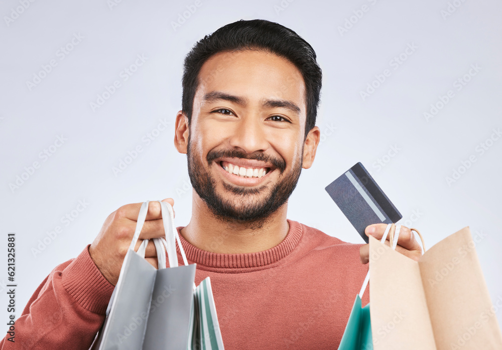 Sticker Shopping bag, portrait and man with happiness, credit card and smile for retail fashion spree, sales or Black Friday deal. Promotion face, studio payment and happy male customer on white background