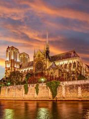 Fototapeta na wymiar Notre Dame de Paris (against the background of a sky at sunset), also known as Notre Dame Cathedral or simply Notre Dame, is a Gothic, Roman Catholic cathedral of Paris, France