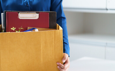 Quit Job Business man sending resignation letter and packing Stuff Resign Depress or carrying business cardboard box in office. Change of job or fired from company.