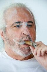 smoking hispanic old man. Exuding sophistication. hispanic old man smoking cuban cigar. Hispanic...