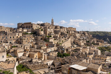 View of the city of Matera by day. Typical Salento illuminations during the holidays. Feast of the Brown Madonna, Matera. Prehistoric caves from the Murgia.Mysterious and ancient land among the stones