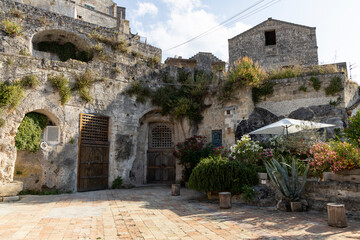 View of the city of Matera by day. Typical Salento illuminations during the holidays. Feast of the Brown Madonna, Matera. Prehistoric caves from the Murgia.Mysterious and ancient land among the stones