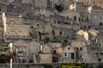 View of the city of Matera by day. Typical Salento illuminations during the holidays. Feast of the Brown Madonna, Matera. Prehistoric caves from the Murgia.Mysterious and ancient land among the stones