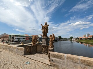 Obraz premium The Pisek Stone Bridge is the oldest preserved early Gothic bridge in the Czech Republic.Pisek town in south Bohemia,historical bridge over Otava river,scenic panorama landscape view