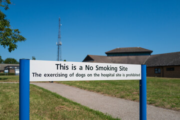 Shallow focus of a generic No Smoking or excising of dogs seen on the campus of an English hospital...