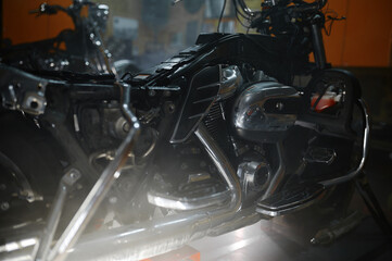Fototapeta na wymiar Closeup motorbike engine block and chromed exhaust pipes