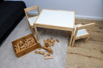 Stylish child table and chair. White and wooden colors