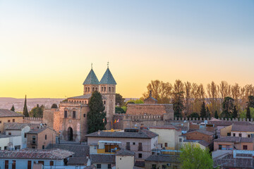 Naklejka premium Toledo Skyline at sunset with Puerta de Bisagra Nueva Gate - Toledo, Spain
