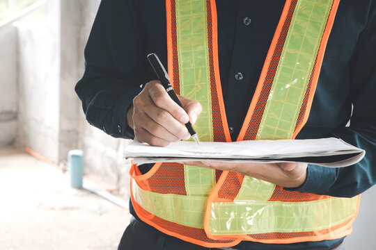 Construction concept of Engineer or architect meeting for project working with partner and engineering tools on model building and blueprint in working site.