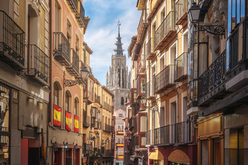 Fototapeta na wymiar Street and Toledo Cathedral Tower - Toledo, Spain