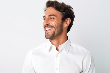 Portrait of a handsome young man smiling isolated on a white background