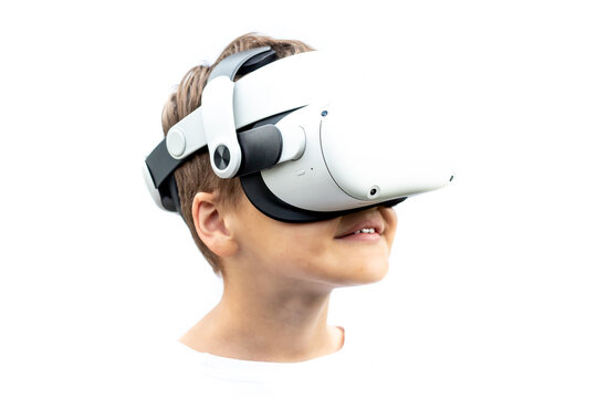 Child playing with VR headset, photo on white background, space for text.
