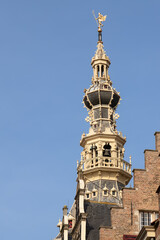 Fototapeta na wymiar Octagonal tower with Neptune on the former town hall of the Dutch port city of Zierikzee in Zeeland.