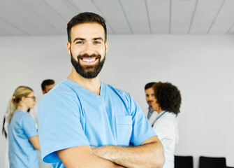 Obraz premium doctor nurse portrait man hospital group team medical uniform health surgeon adult stethoscope smiling professional clinic medicine male happy female occupation teamwork care