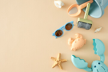 The concept of a kid-centric summer vacation by the beach. Top view composition of eyeglasses,...