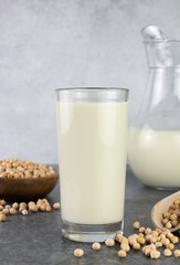 Chickpea milk with chickpeas on a gray background. Lactose free milk. Alternative dairy product.