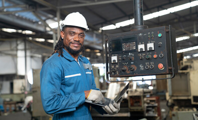 African engineer working at factory