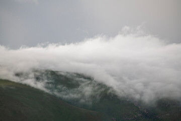 Beautiful landscape,  clouds in the mountains after rain.
