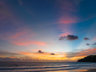 Naklejka premium Aerial panorama view scene romantic pink sky on sunset at Karon beach. .abstract nature background..Sunset with bright pink light rays and other atmospheric effects. .abstract nature background.