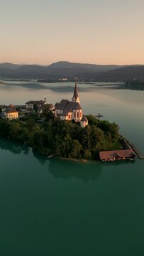 Woerthersee Lake in Carinthia Austria with Church of Maria Worth - Aerial Drone Footage