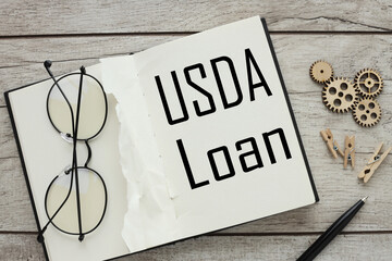 USDA loan top view of an open notepad. words on white page