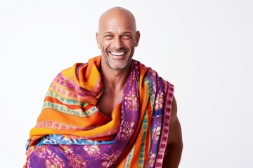 man in his 40s that is wearing a vibrant sarong against a white background