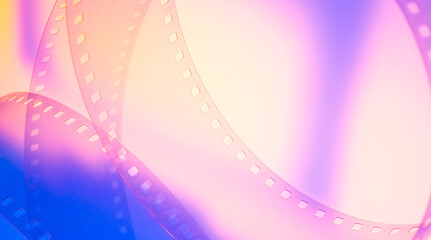 abstract colored cinematic background with film strip.background banner for film premiere festivals...