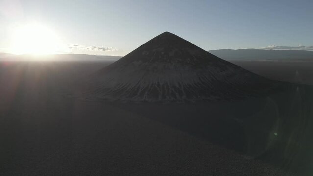 Perfectly shaped Cono de Arita in the Salar de Arizaro in the morning - Exploring the Argentinian highlands called Puna while traveling South America 