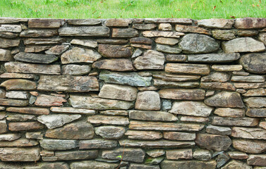 stone wall, weathered by time, evoking strength, resilience, and the enduring beauty of nature's elements. Symbolizing stability and history