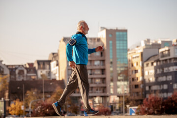 Senior man running outdoors