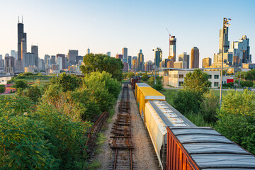 Chicago, Illinois skyline at dusk with freight train. 