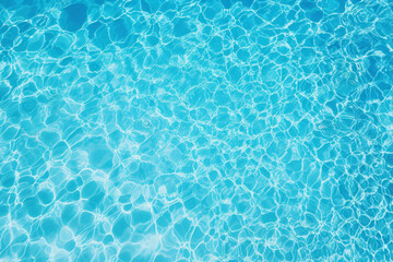 Obraz premium Top view of the blue water texture in the swimming pool background. Generative ai.