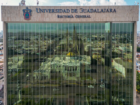 Facade of the University of Guadalajara with the reflection of the Arts Museum of the University of Guadalajara on its windows.