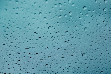 Rain water drops on glass close-up view