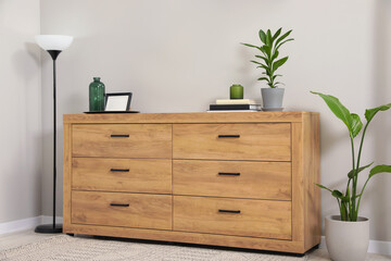 Cozy room interior with chest of drawers, mirrors and decor elements