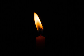 Candle flame, Yellow candle light burn against black background.