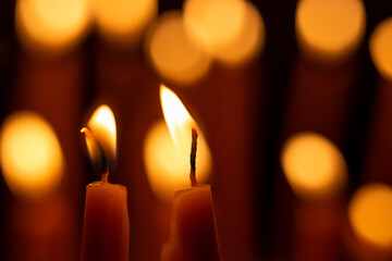 Candle flame, Yellow candle light burn against black background.