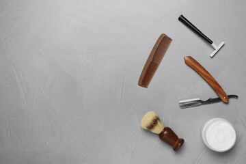 Fototapeta na wymiar Set of men's shaving tools on light gray table, flat lay. Space for text