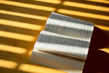 sunshine illuminated  Bible open to Psalms on wooden table