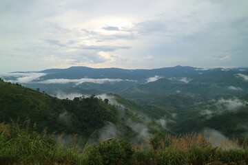 mountains sky white clouds background