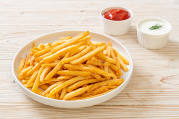 French fries with sour cream and ketchup