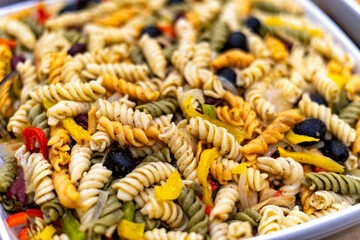 Colorful pasta salad bowl closeup