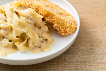 fettuccine pasta white cream sauce with fried fish