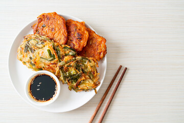 Pajeon or Korean pancake and Korean Kimchi pancake or Kimchijeon on white background