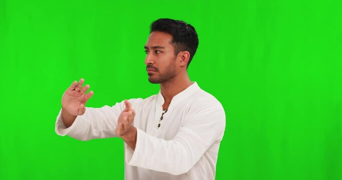 Asian man, tai chi and spiritual energy on green screen in healthy exercise against a studio background. Portrait of calm male person in motion meditation, self defense or inner peace on mockup space