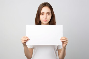 Fototapeta premium woman holding blank white board