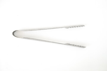 Ice tongs on a white background